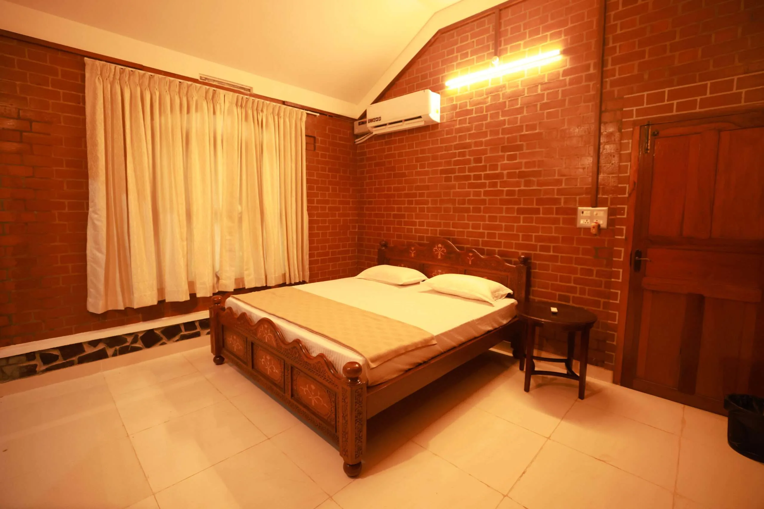Deluxe King Bedroom with Exposed Brick Finish