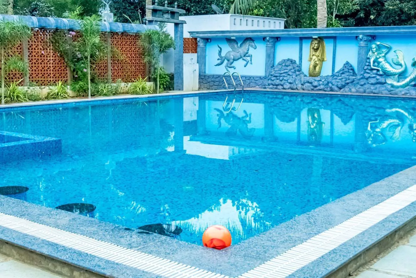 Crystal Clear Swimming Pool with Sun Deck